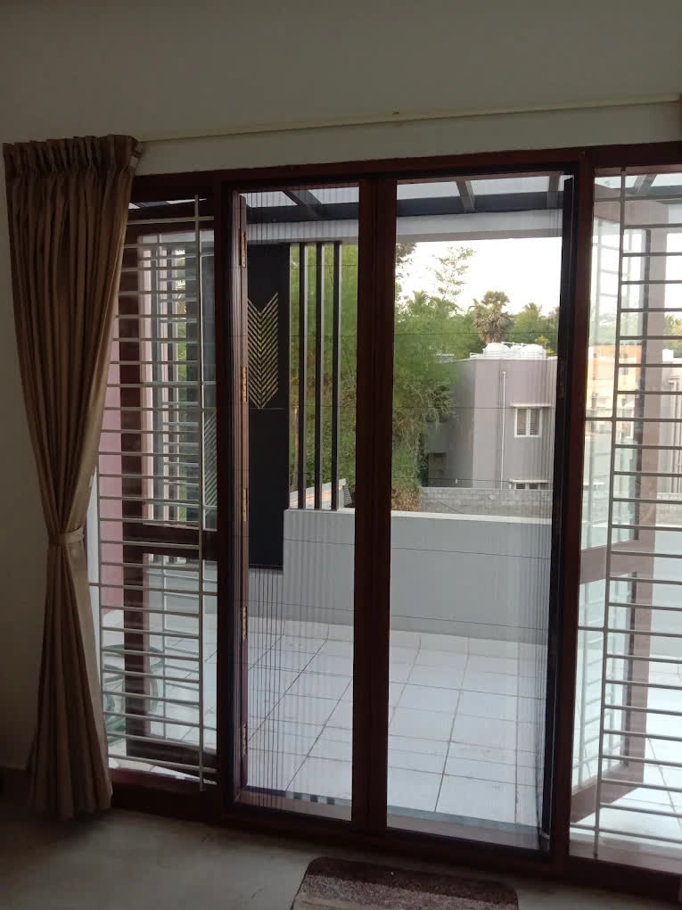 Pleated net on a balcony door