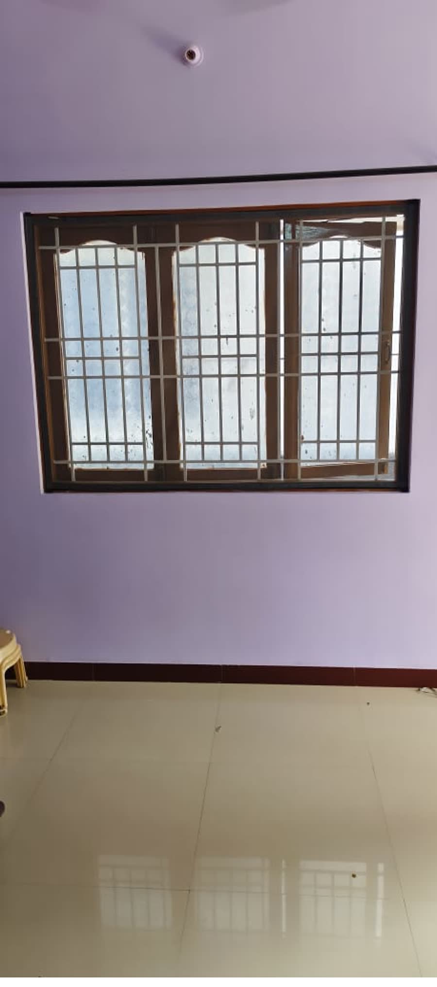 A velcro net across a wide three-panel window