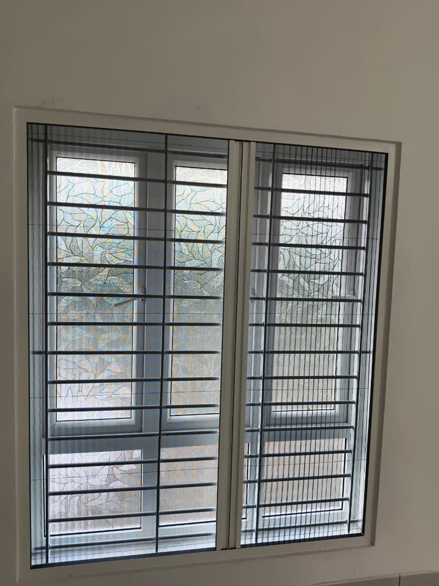 Pleated net on a window, folded across